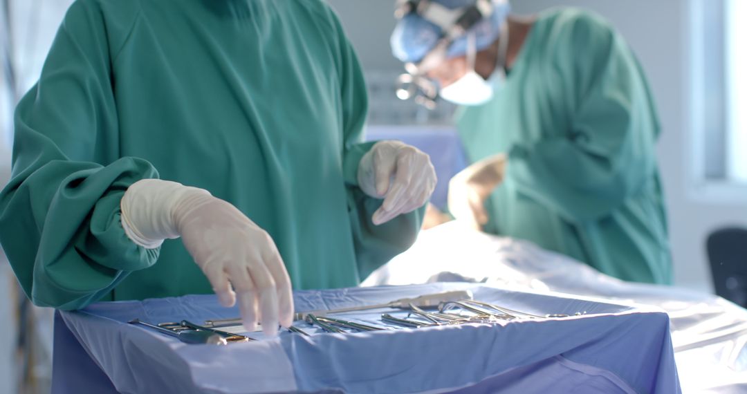 Team of Surgeons Preparing Instruments in Operating Room