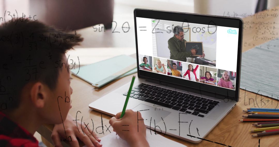 Asian Boy Engaged in Virtual Math Lessons with Online Tutor via Laptop