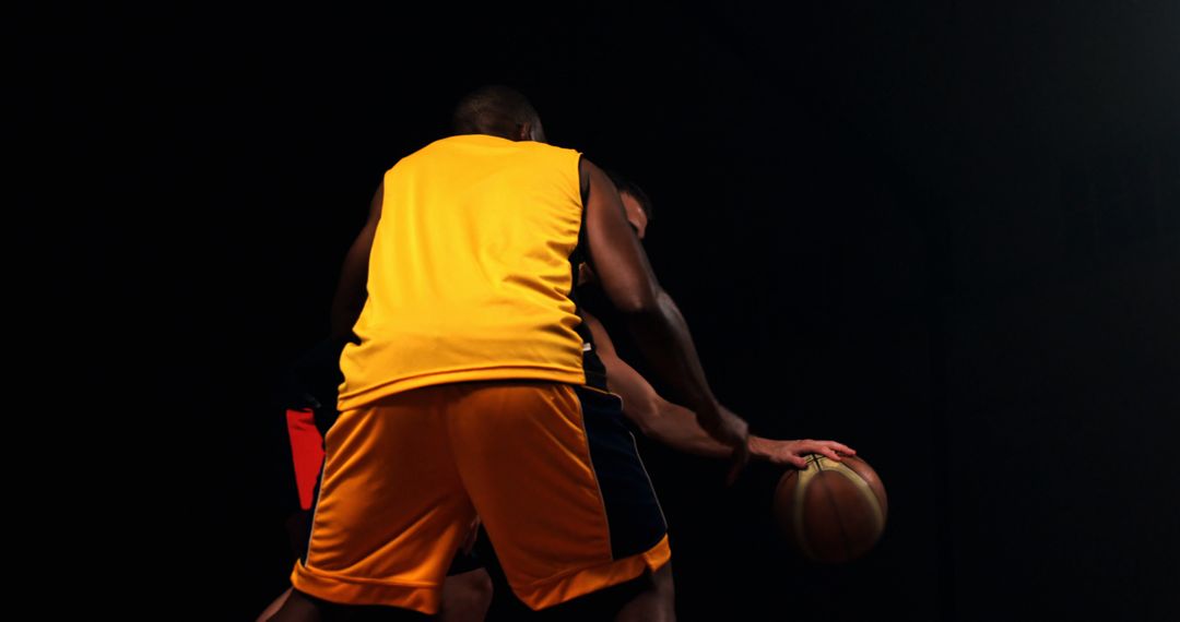 Intense Basketball Game in Low Light Arena - Free Images, Stock Photos and Pictures on Pikwizard.com