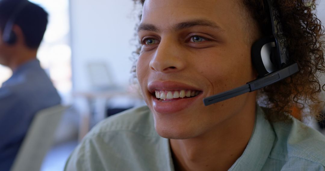 Customer Service Representative Smiling While Using Headset