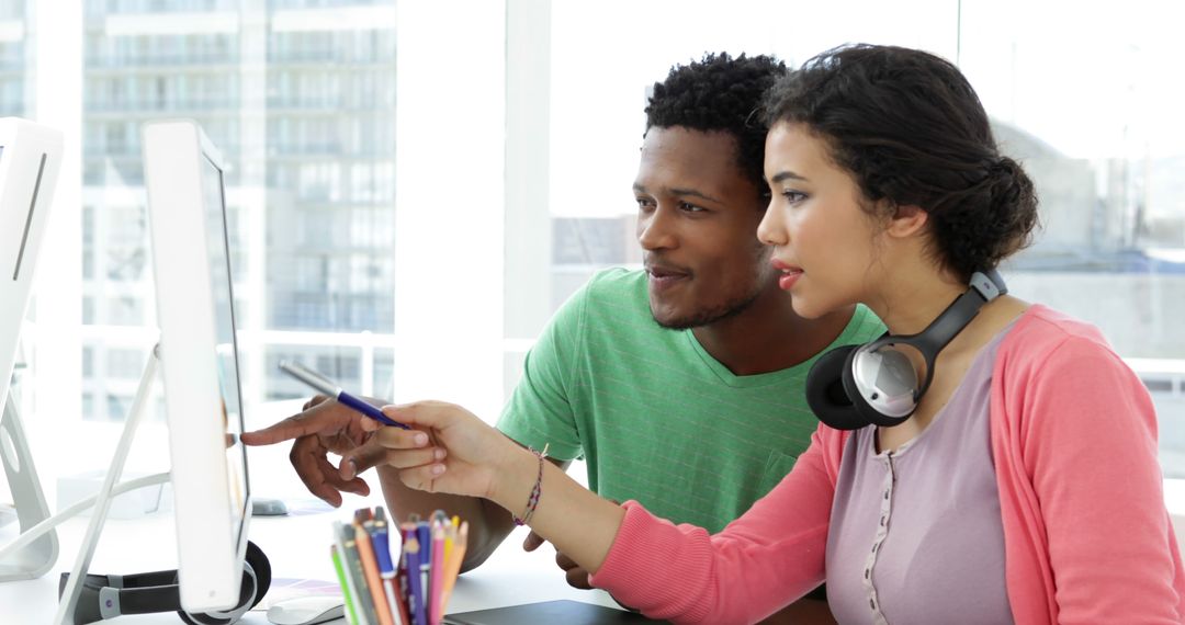 Collaborative Designers Brainstorming on Project at Modern Office