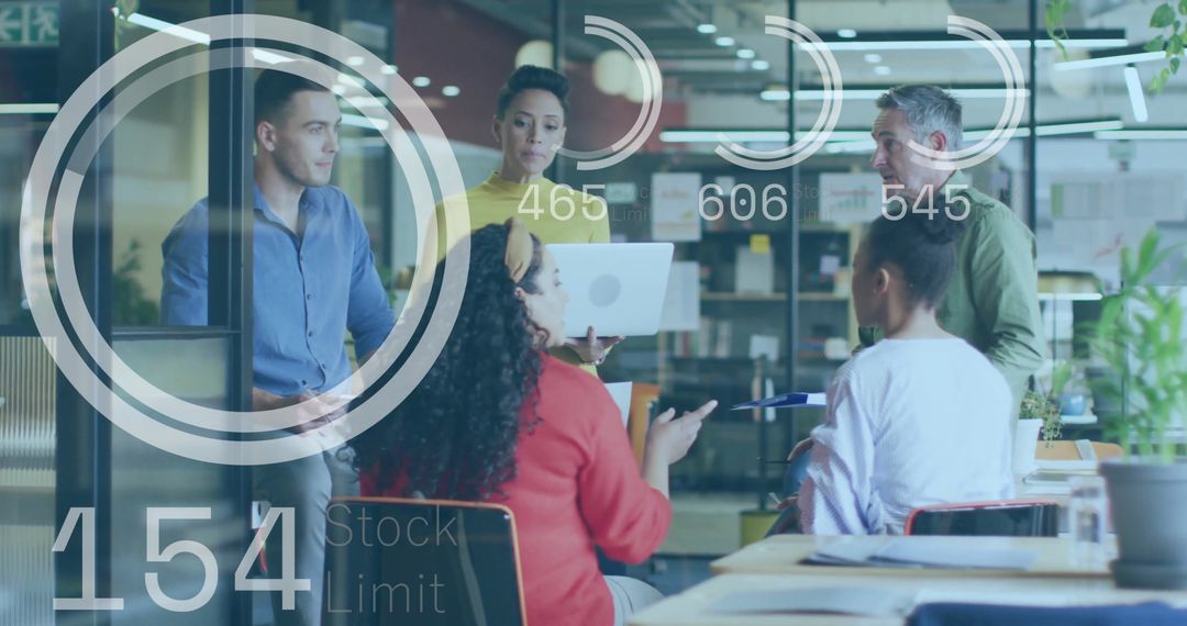 Diverse Business Team Analyzing Digital Data Interfaces