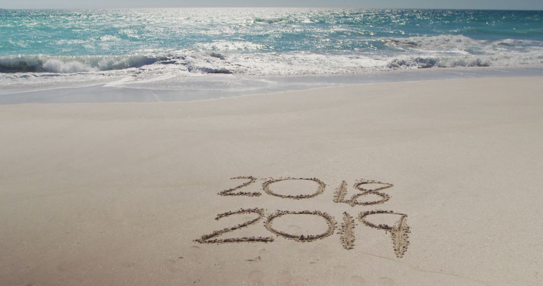 Transition from 2018 to 2019 Written on Sandy Beach - Free Images, Stock Photos and Pictures on Pikwizard.com