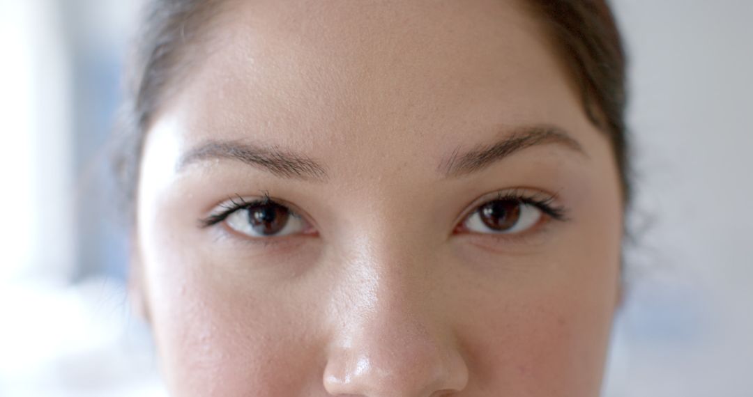 Closeup of Female Doctor's Eyes Reflecting Confidence