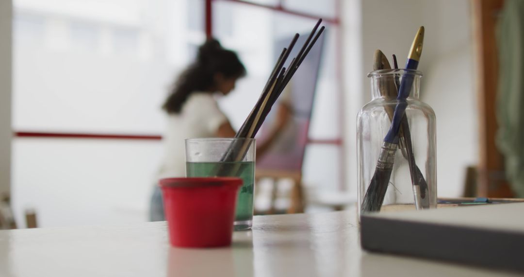 Creative Art Studio Scene with Student Blurred in Background