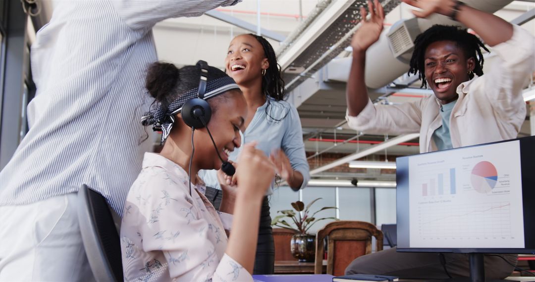 Diverse Team Celebrating Office Success with High Fives