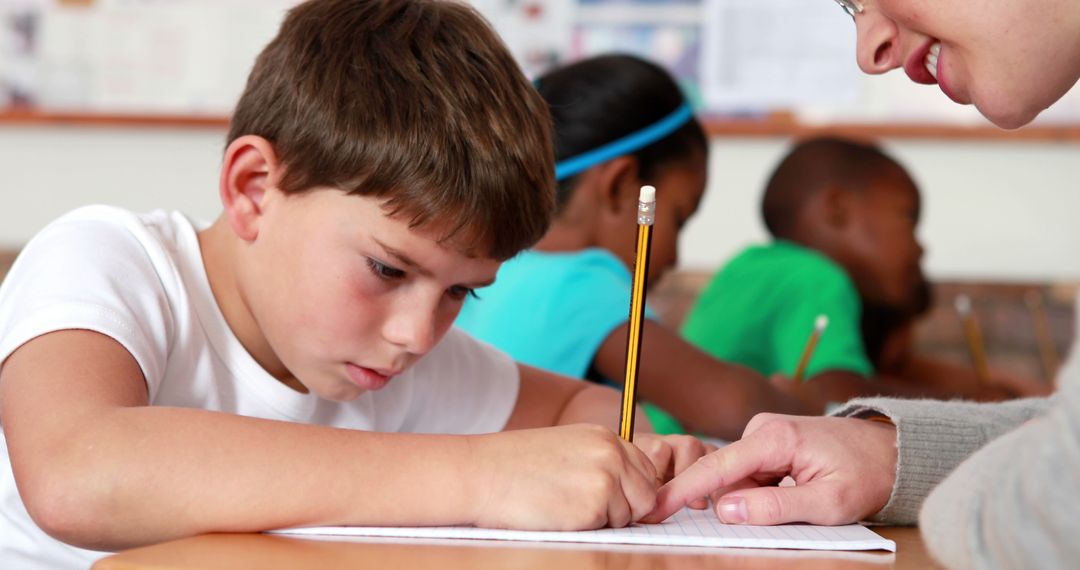 Elementary Teacher Guiding Student During Lesson