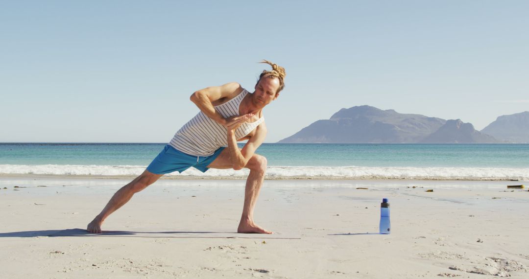 Man Practicing Yoga on Beach in Bright Sunshine - Free Images, Stock Photos and Pictures on Pikwizard.com