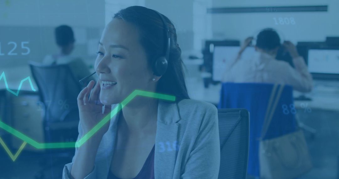 Businesswoman Collaborating in Open-Office Setting with Technology