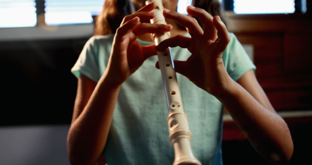 Young Girl Playing Recorder in Natural Light - Free Images, Stock Photos and Pictures on Pikwizard.com