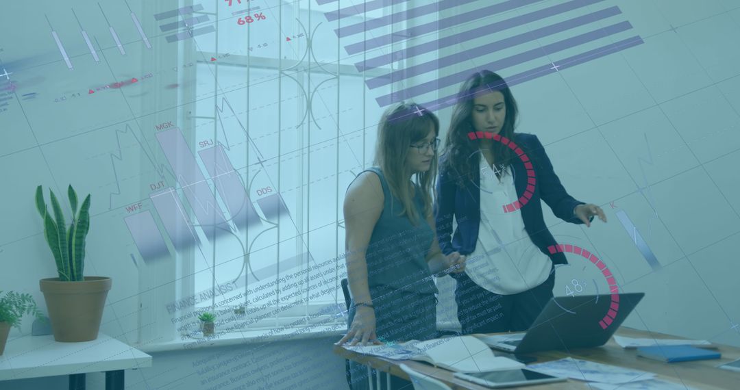 Women Analyzing Data with Technology in Modern Office