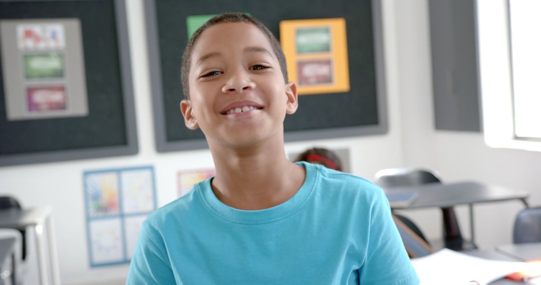 Joyful Boy Smiling Brightly in Classroom Setting