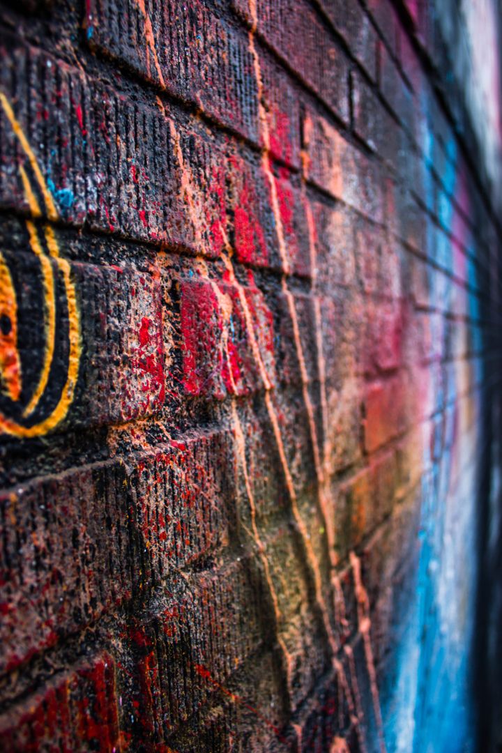 Grunge Brick Wall with Colorful Graffiti Artwork - Free Images, Stock Photos and Pictures on Pikwizard.com