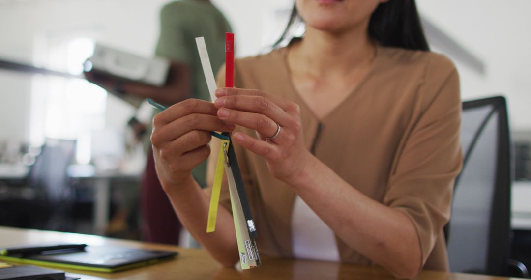 Creative Professional Examining Color Swatches at Work