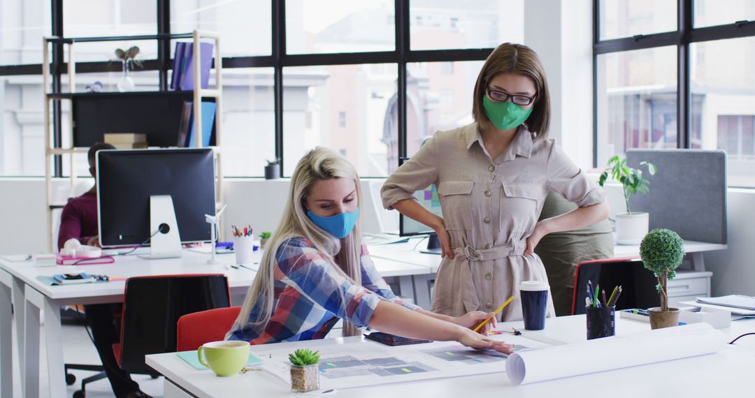 Coworkers Collaborating on Project with Face Masks in Modern Office - Free Images, Stock Photos and Pictures on Pikwizard.com