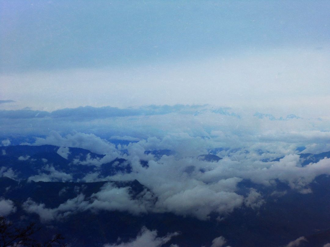 Mountains peaks above the clouds - Free Images, Stock Photos and Pictures on Pikwizard.com