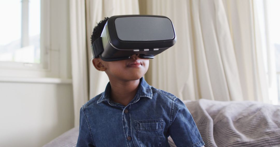Young Boy Using Virtual Reality Headset in Living Room - Free Images, Stock Photos and Pictures on Pikwizard.com