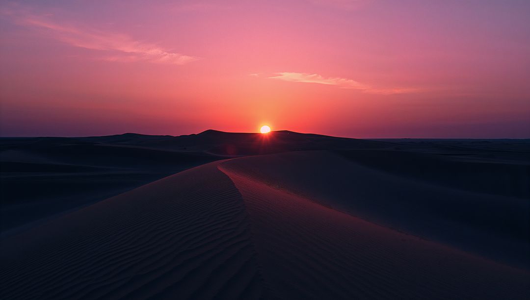Mesmerizing Desert Sunset with Silhouetted Sand Dunes
