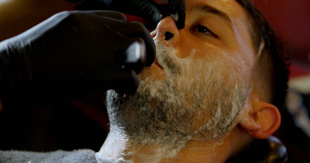 Barber Shaving Client Beard with Foam and Straight Razor - Free Images, Stock Photos and Pictures on Pikwizard.com