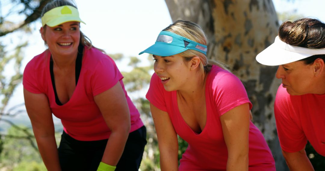 Group of Women Resting During Outdoor Exercise in Bright Athletic Gear - Free Images, Stock Photos and Pictures on Pikwizard.com