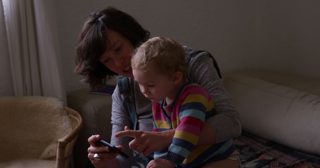 Mother and Toddler Bonding Over Mobile Phone at Home - Free Images, Stock Photos and Pictures on Pikwizard.com