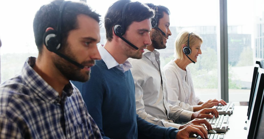 Customer Service Team Working on Headsets in Modern Office