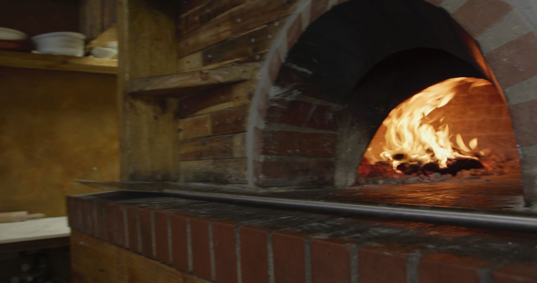 Wood-Fired Brick Oven with Flames in Rustic Kitchen - Free Images, Stock Photos and Pictures on Pikwizard.com