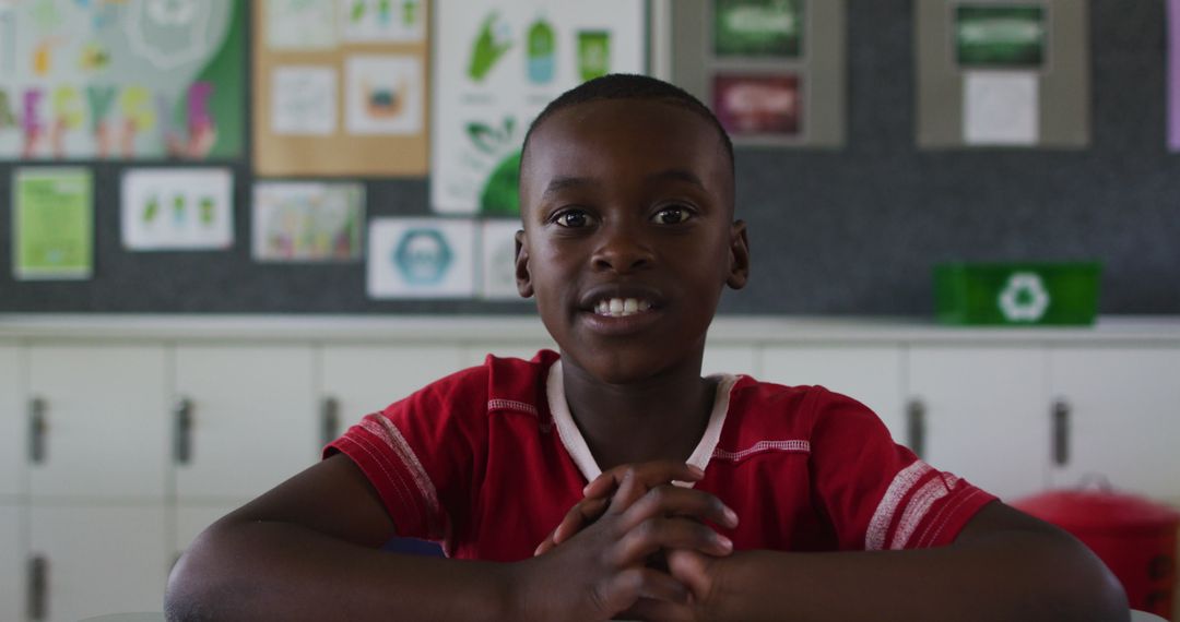 African American Boy Enthusiastically Participating in Classroom Discussion