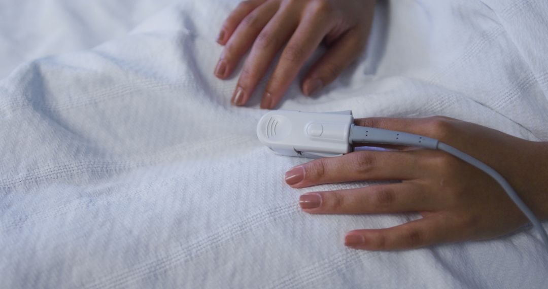 Female Patient Resting in Hospital with Pulse Oximeter on Finger - Free Images, Stock Photos and Pictures on Pikwizard.com