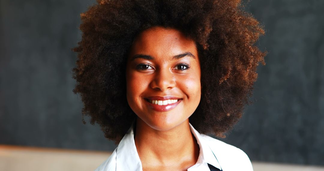Smiling Waitress with Afro Holding Coffee in Restaurant