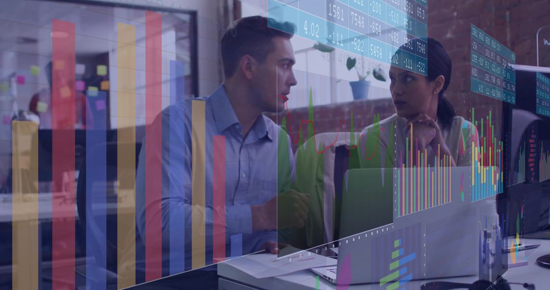 Collaborating on data dashboards with laptop and chart overlays in modern open-plan office