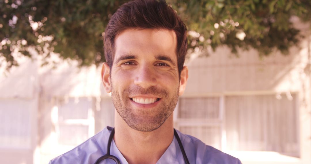 Smiling Male Nurse in Outdoors Under Tree Foliage - Free Images, Stock Photos and Pictures on Pikwizard.com