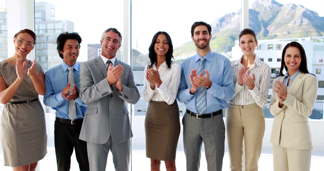 Diverse Business Team Applauding in Modern Office with Scenic View - Free Images, Stock Photos and Pictures on Pikwizard.com