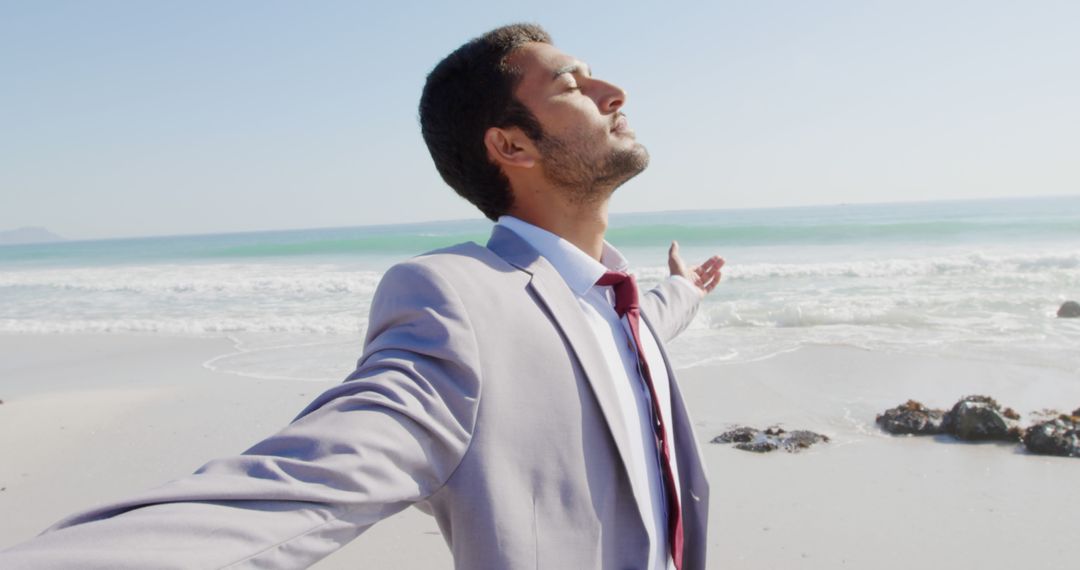 Businessman Enjoying Beach with Open Arms and Eyes Closed - Free Images, Stock Photos and Pictures on Pikwizard.com