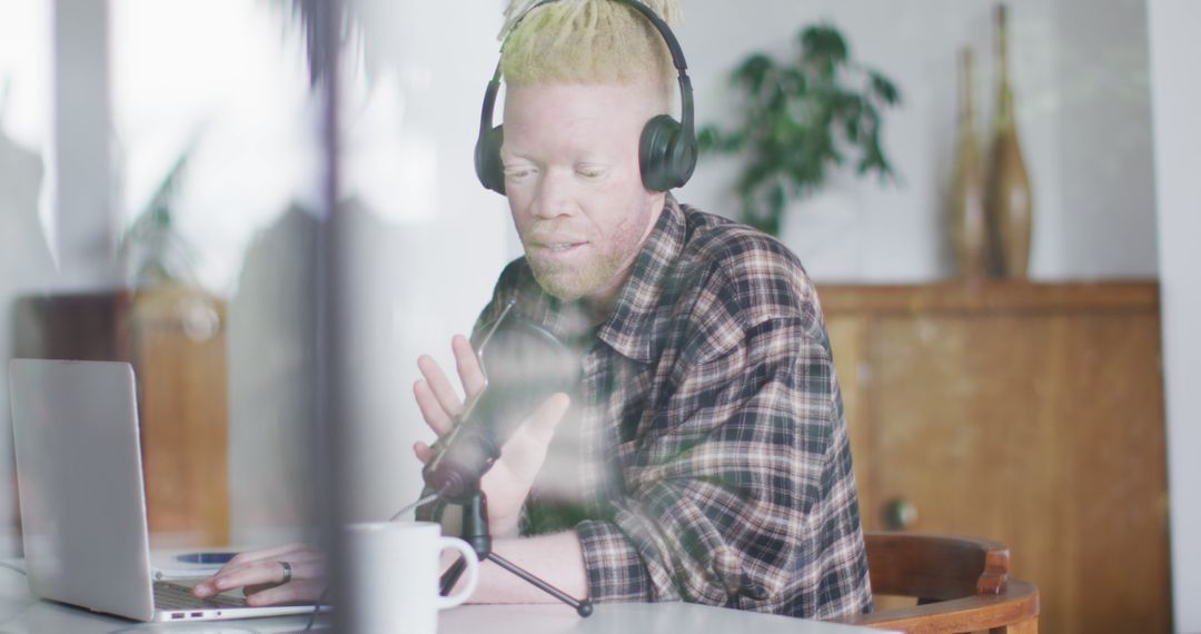 Man with Albinism Recording Podcast in Home Studio - Free Images, Stock Photos and Pictures on Pikwizard.com