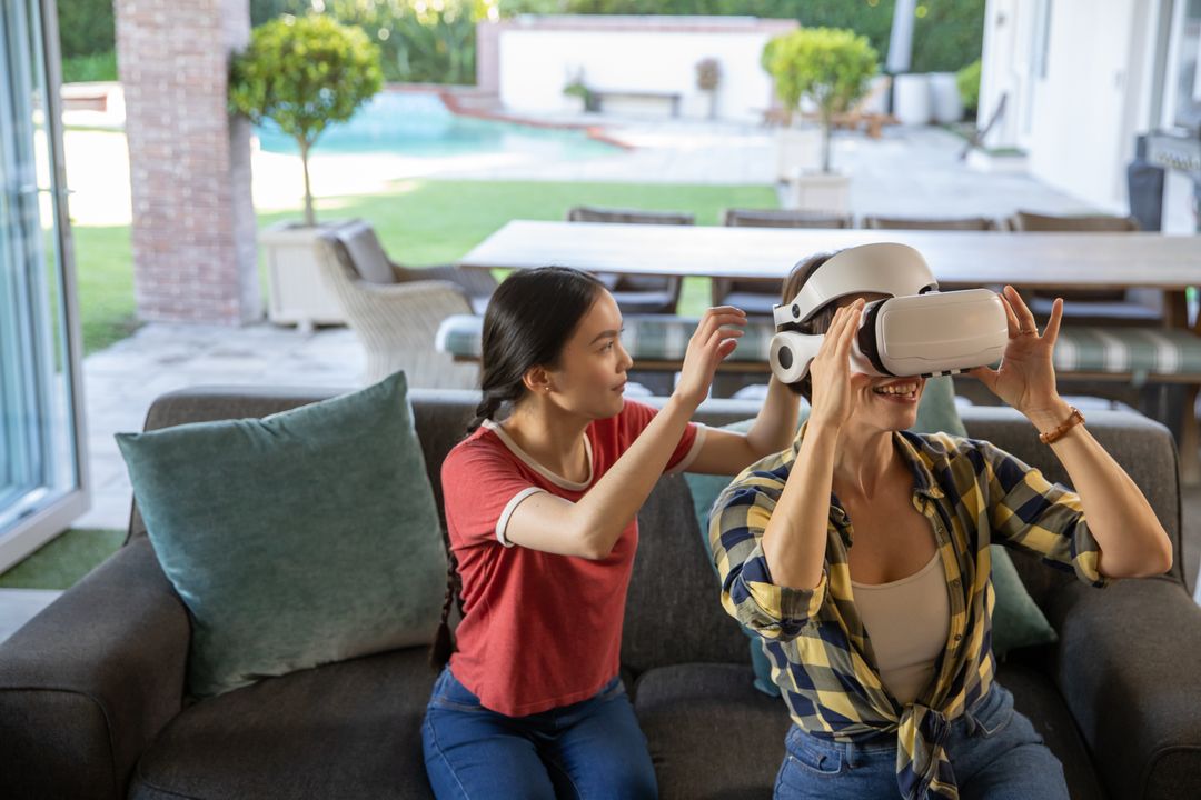 Mother and Daughter Engaging with Virtual Reality at Home