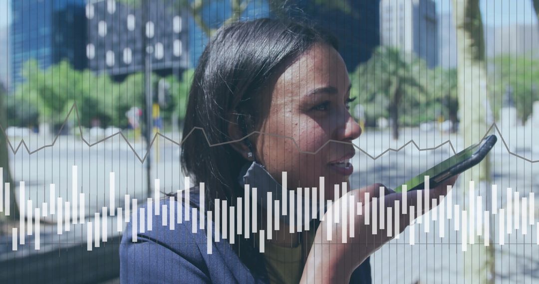 Tech-Savvy Businesswoman Using Voice Command Smartphone Outdoors