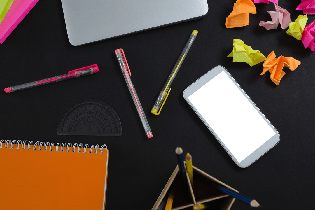 Transparent Desk with Laptop, Smartphone, and Colorful Stationery