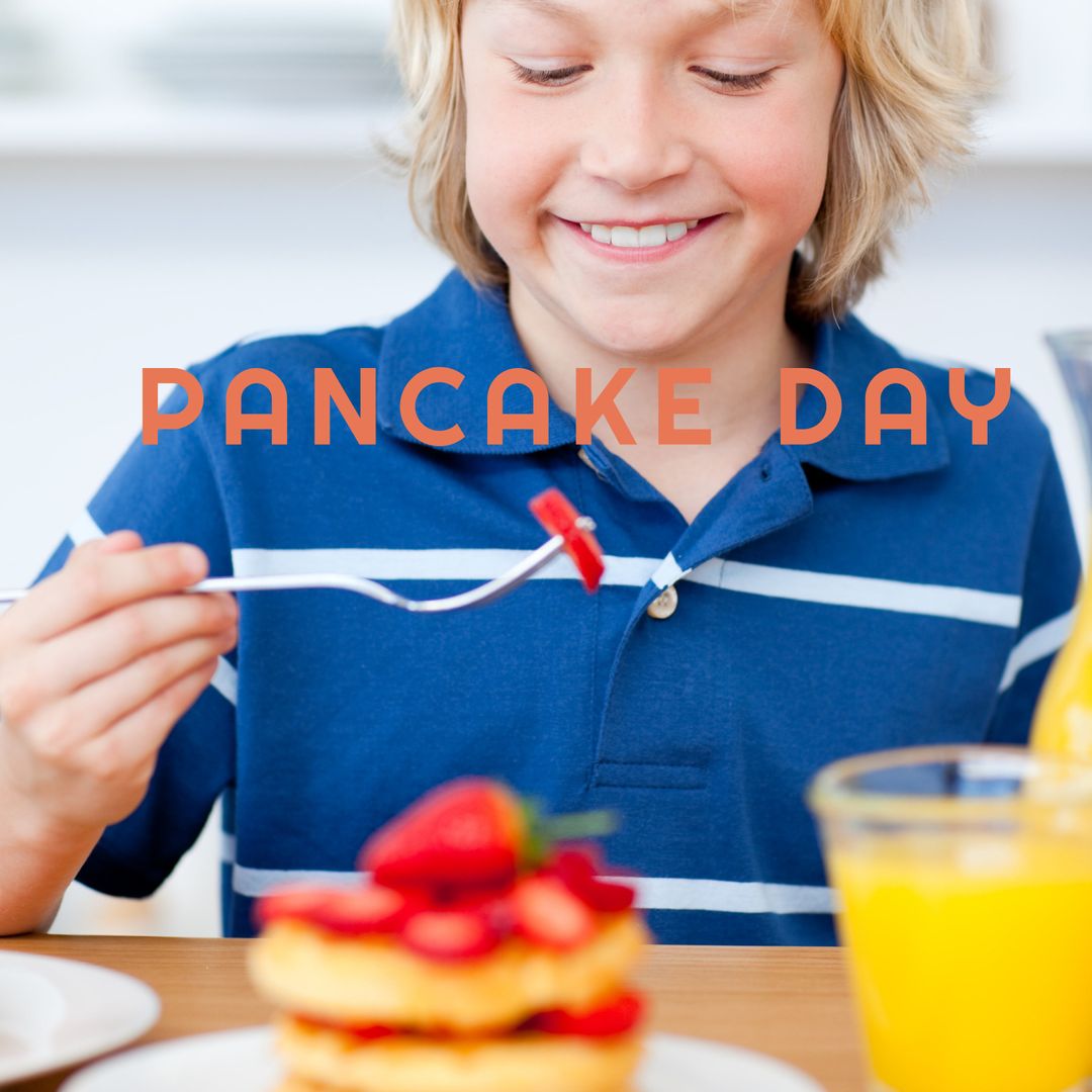 Young Boy Enjoying Pancakes with Fresh Strawberries