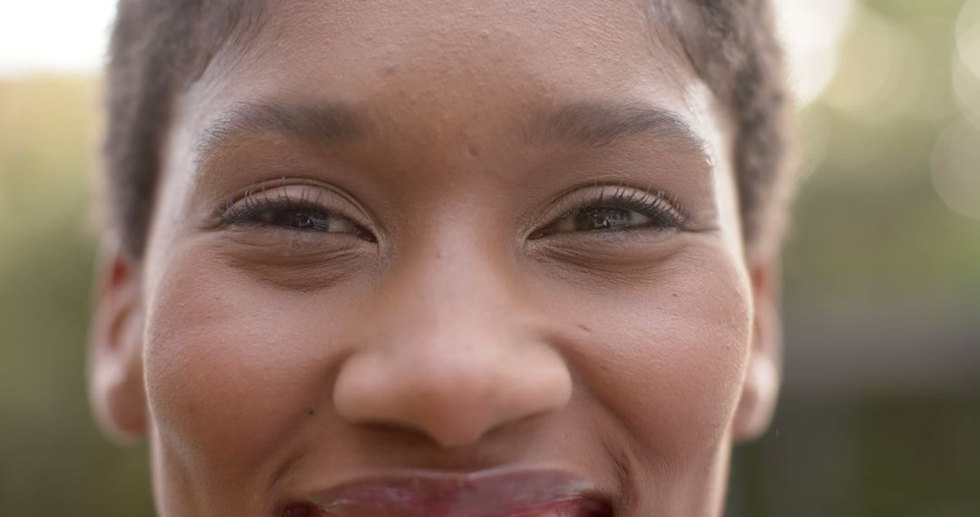 Close-Up of Smiling African American Woman with Short Hair - Free Images, Stock Photos and Pictures on Pikwizard.com