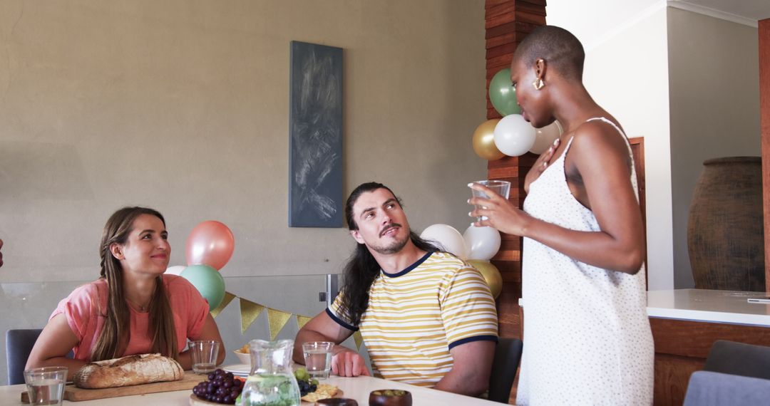 Friends Socializing at Casual Home Gathering with Refreshments