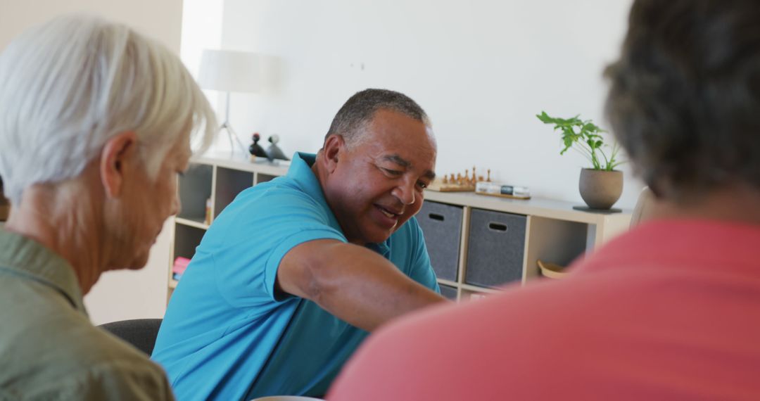 Group of multi-ethnic retirees engaging in indoor board game - Free Images, Stock Photos and Pictures on Pikwizard.com