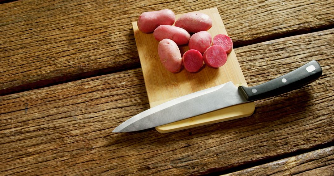 Raw Red Potatoes on Wooden Cutting Board with Knife - Free Images, Stock Photos and Pictures on Pikwizard.com