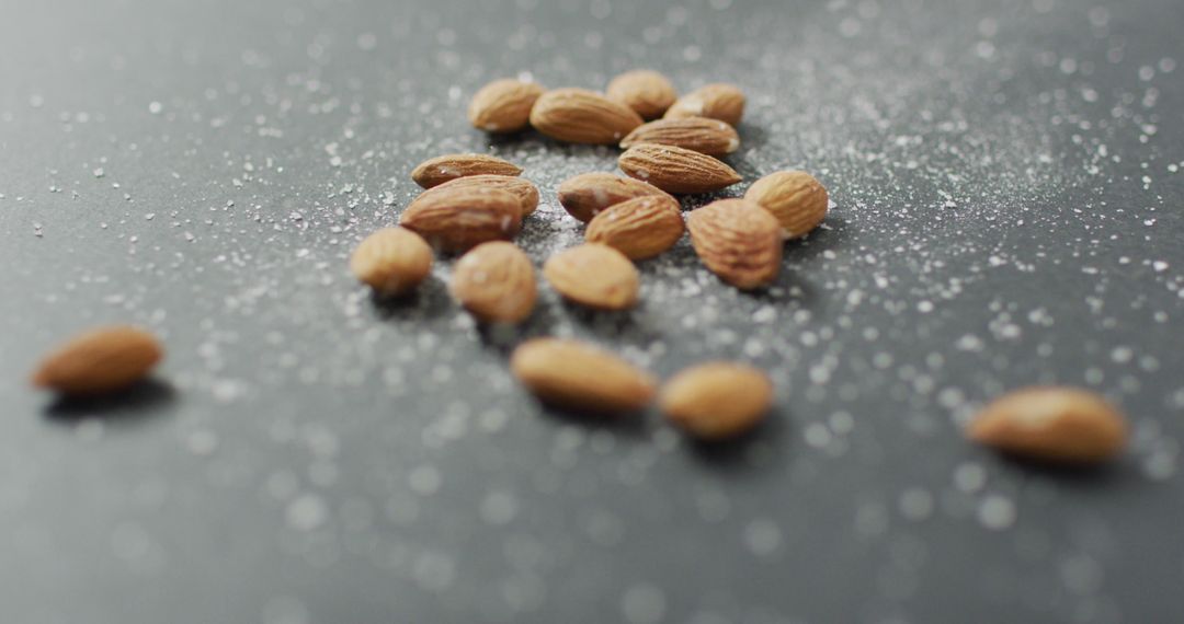 Fresh Almonds Arranged on Dusty Grey Surface for Vegan Diet Concept