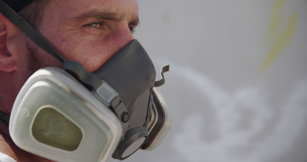 Close-Up of Worker in Protective Mask Against Background - Free Images, Stock Photos and Pictures on Pikwizard.com