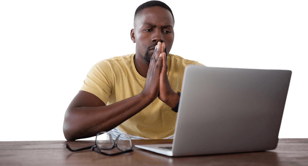 Young Man Concentrating While Looking at Laptop with Transparent Background