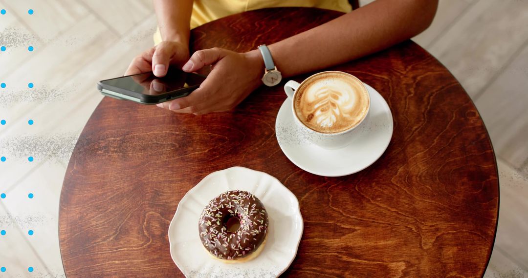 Casual Coffee Shop Moment with Latte Art and Donut