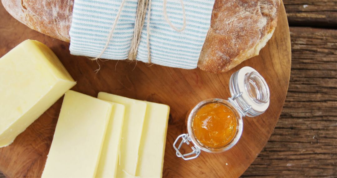 Freshly Baked Bread with Butter and Jam on Rustic Wooden Table - Free Images, Stock Photos and Pictures on Pikwizard.com