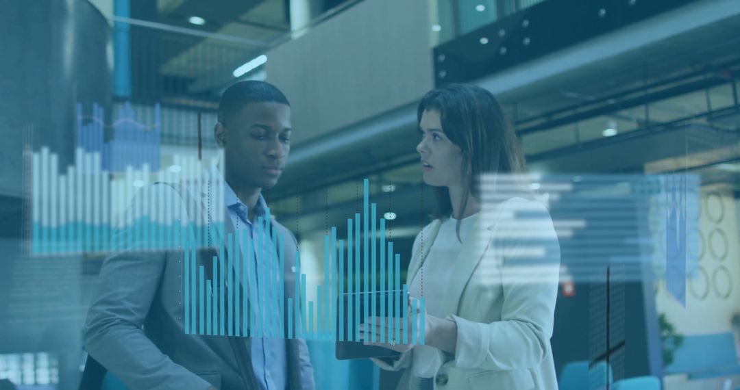 Colleagues Discussing Holographic Bar Graphs in Modern Office Atrium
