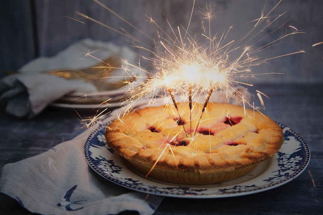 Festive Cherry Pie with Sparkler Candles on Holiday Table - Free Images, Stock Photos and Pictures on Pikwizard.com